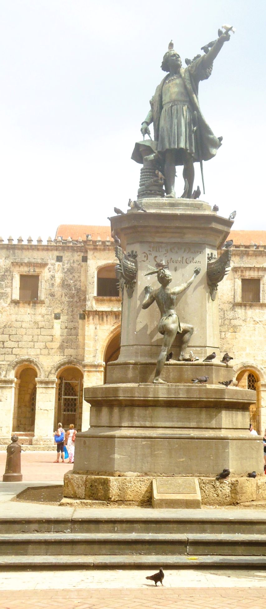 Statue of Christopher Columbus in front of a castle-like building in Santo Domingo.
